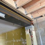 Close up image of steel beams, trusses and brickwork in a new build house