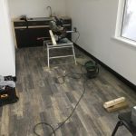 Laminate flooring with kitchen in office building